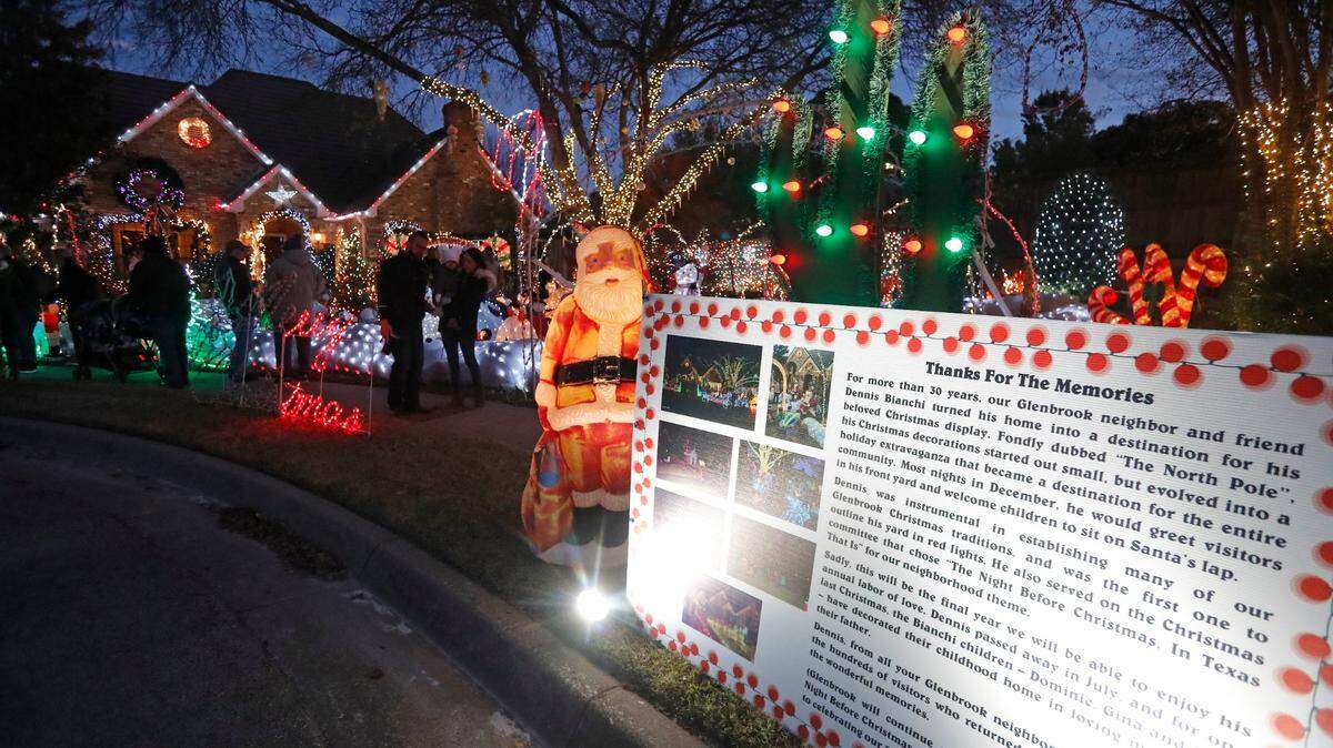 A sign outside the home of Dennis Bianchi explains the lighting tradition for his final year in the Glenbrook neighborhood in Bedford, Texas, Sunday, Nov. 25, 2018.
