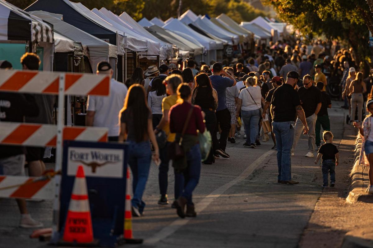 Event attendees make their way down Magnolia Avenue during the Arts Goggle event on Magnolia Avenue in Fort Worth on Saturday, Oct. 19, 2024.