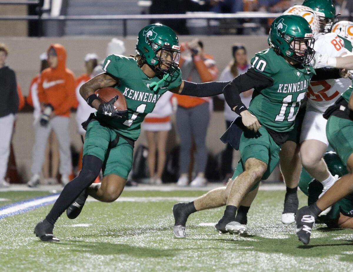 Kennedale’s Lawrence Watkins looks for a running lane during a UIL football playoff game at Pennington Field on Friday November 22, 2024.