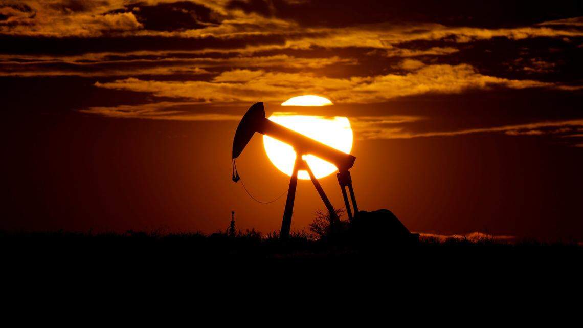 “Landman,” a modern day tale of fortune seeking in the world of oil rigs will premiere on Paramount+. In this Wednesday, April 8, 2020, file photo, the sun sets behind an idle pump jack near Karnes City, Texas. 