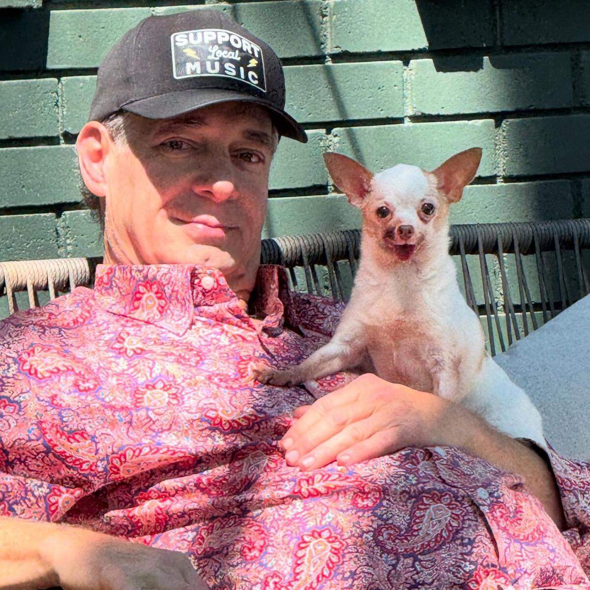 Adam Wyse with a dog he and his wife care for. “People do not want to have them for a relatively short period of time only to have to let them go.”