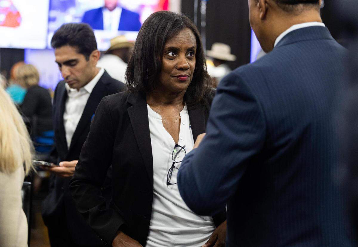 Alisa Simmons who is running for county commissioner district 2 chats with attendees at the election watch party Tuesday, Nov. 8, 2022, at Turkey Den in Fort Worth.