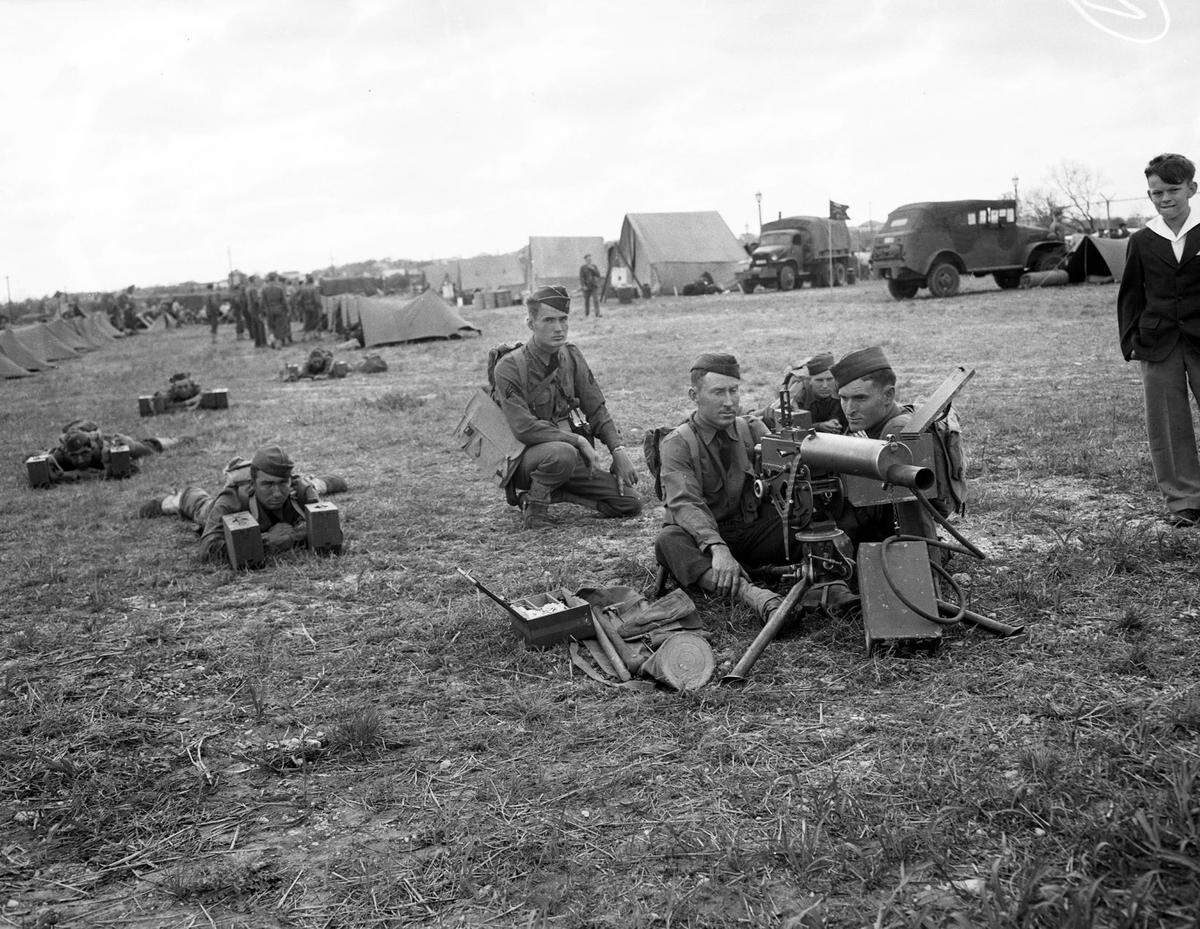 A machine gun crew from D Company, 155th Infantry, 31st Division was a big draw at the Army Day celebration at Farrington Field in Fort Worth April 6, 1942.