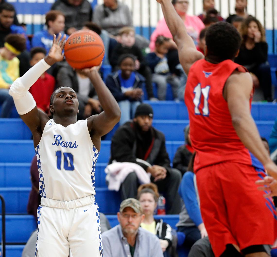 Brewer guard Devin Avent (10) gets a shot over Grapevine’s Preston Jeans (11) in the second quarter of a high school basketball game at Brewer High School in White Settlement, Texas, Friday, Feb. 14, 2020. Grapevine led by three at the half. (Special to the Star-Telegram Bob Booth)
