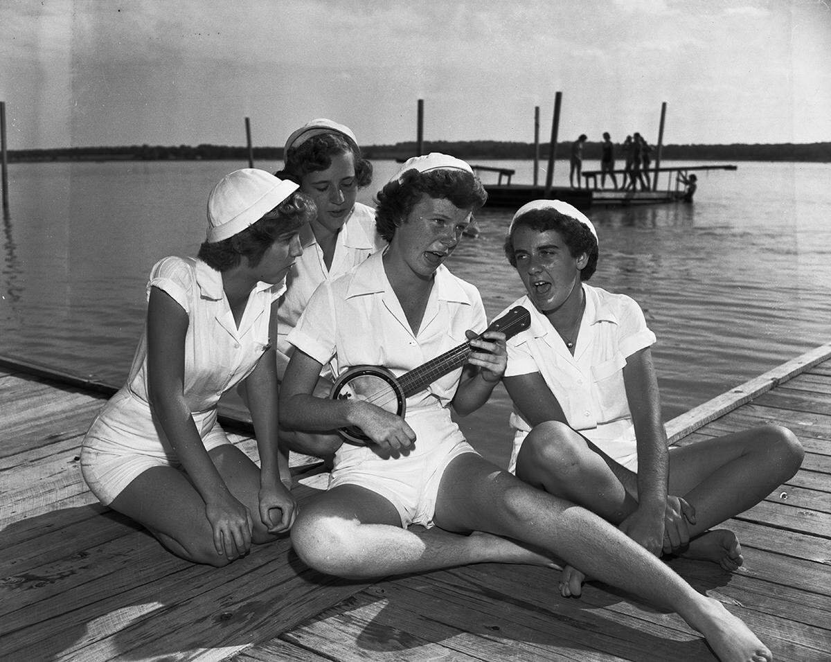 Sept. 24, 1950: Four Mariner Girl Scouts make music at the fifth annual celebration of the founding of Camp Timberlake at Eagle Mountain Lake. The scouts, left to right, are Lillian Jones, 4212 Locke, daughter of Mr. and Mrs. A.G. Jones Jr.; Martha Ann Emery, 2120 Tremont, daughter of Dr. and Mrs. O.J. Emery; Margie Schumacher; and Sandra Kautz, 4217 Lovell, daughter of Mr. and Mrs. H.M. Kautz.