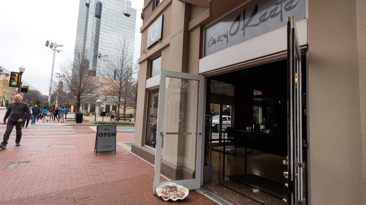 Passersby walk near Cary O’Keefe jewelry shop in March in downtown Fort Worth.