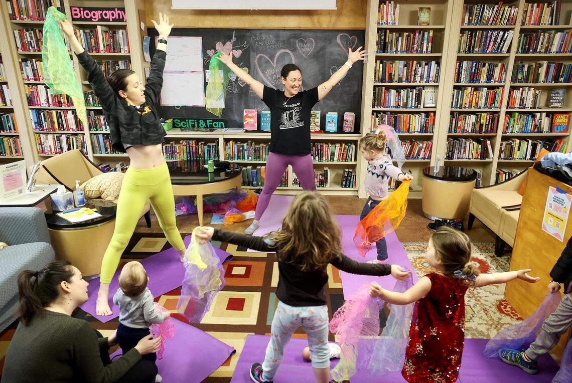 Brooke Blankenship, executive director and founder of Yogi Squad, leads a yoga class for toddlers at Fairmount Community Library on Tuesday, January 23, 2024. Yogi Squad is a nonprofit that provides yoga services throughout Fort Worth. The class features a literacy component to engage and adapt yoga techniques for children.