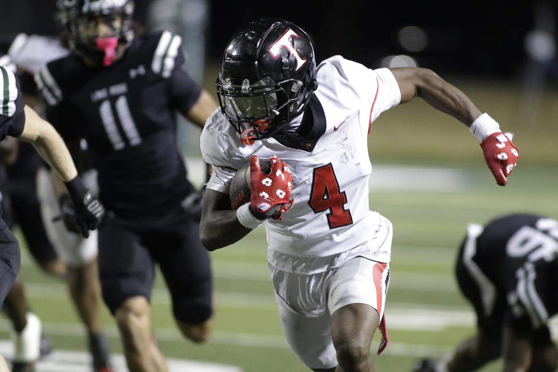 Euless Trinity running back Keondre Dixon (4) breaks free for a touchdown against Mansfield Lake Ridge during their Class 6A Division I bi-district game on Friday, November 14, 2025 at Newsom Stadium in Mansfield Texas.
