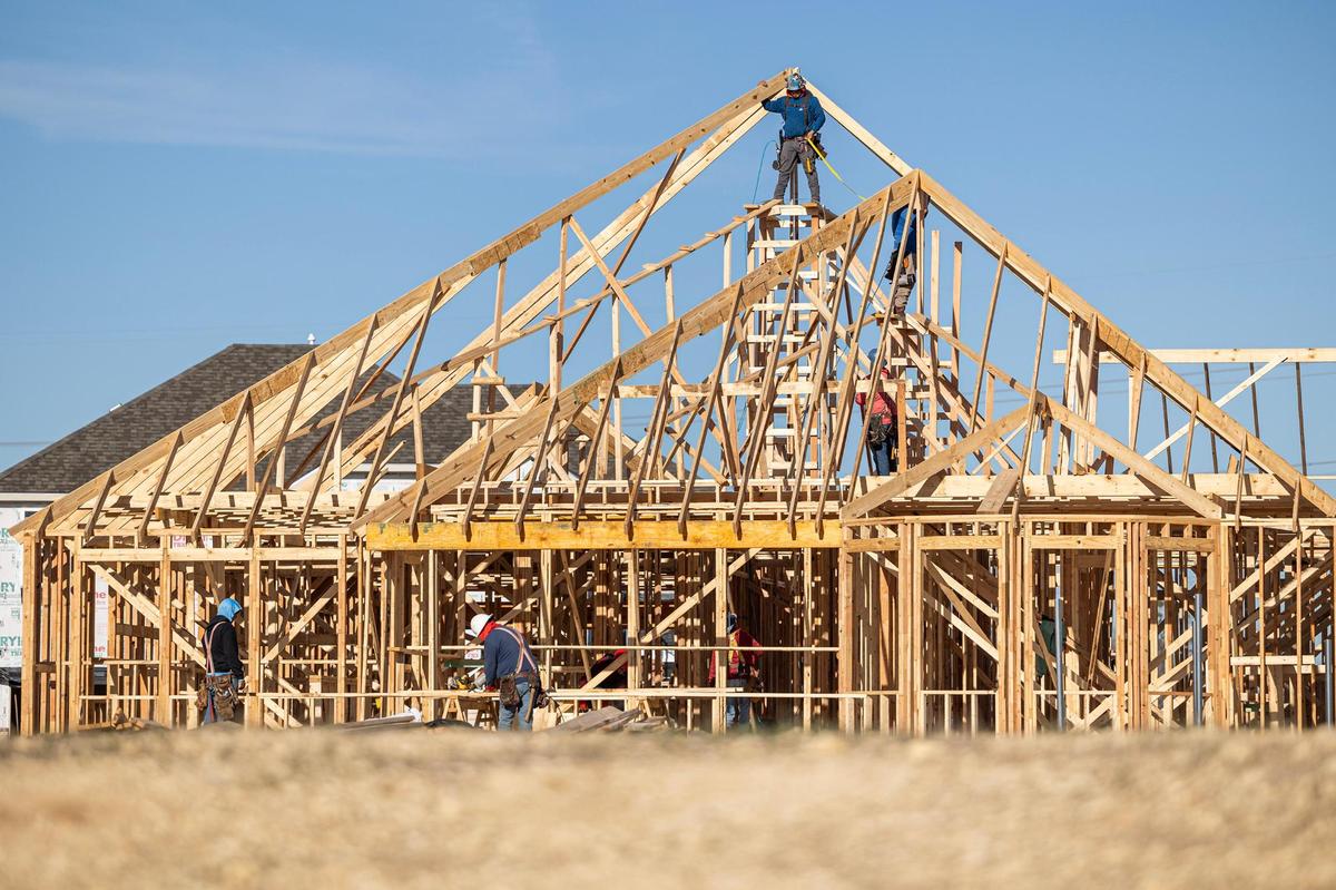 Construction workers work on one of the 151 houses at a home development by Pulte Homes near the intersection of Bonds Ranch Road and Willow Springs Road in North Fort Worth on Friday, Dec. 27, 2024. Rapid development is concerning some residents who fear the quiet country lifestyle will cease to exist.