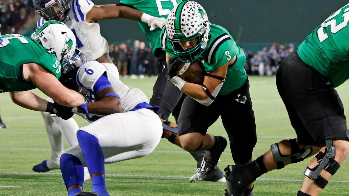 Carroll running back Davis Penn (3) finds a hole in the line as he crosses the goal line during the first half of a UIL Conference 6A Division 2 quarterfinal football playoff game at Choctaw Stadium in Arlington, Texas, Saturday, Dec. 02, 2023.