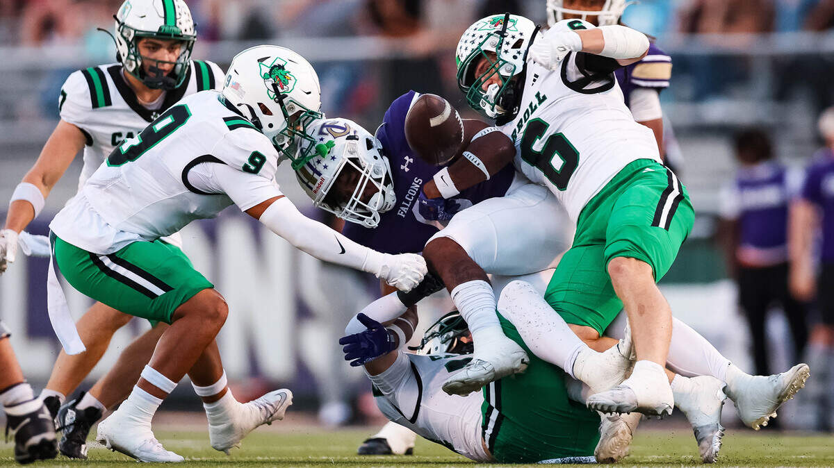 Southlake Carroll defensive back Weston Duffy punches the ball from a Keller Timber Creek running back that lead to a fumble in a district matchup at Keller ISD Stadium on Thursday Sept. 25, 2025.
