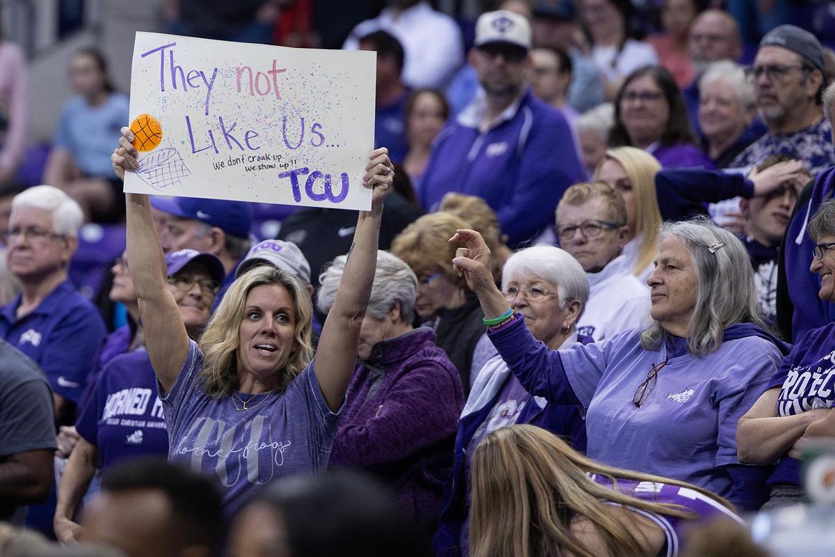 A TCU fan holds up a sign saying in the second half of an NCAA game between TCU and Houston at Schollmaier Arena in Fort Worth on Wednesday, Feb. 26, 2025.