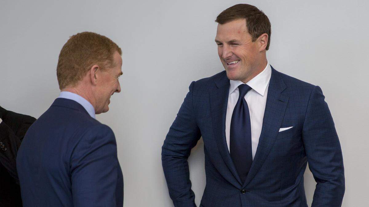 Jason Witten, right, talks with Dallas Cowboys coach Jason Garrett after Witten's retirement ceremony.