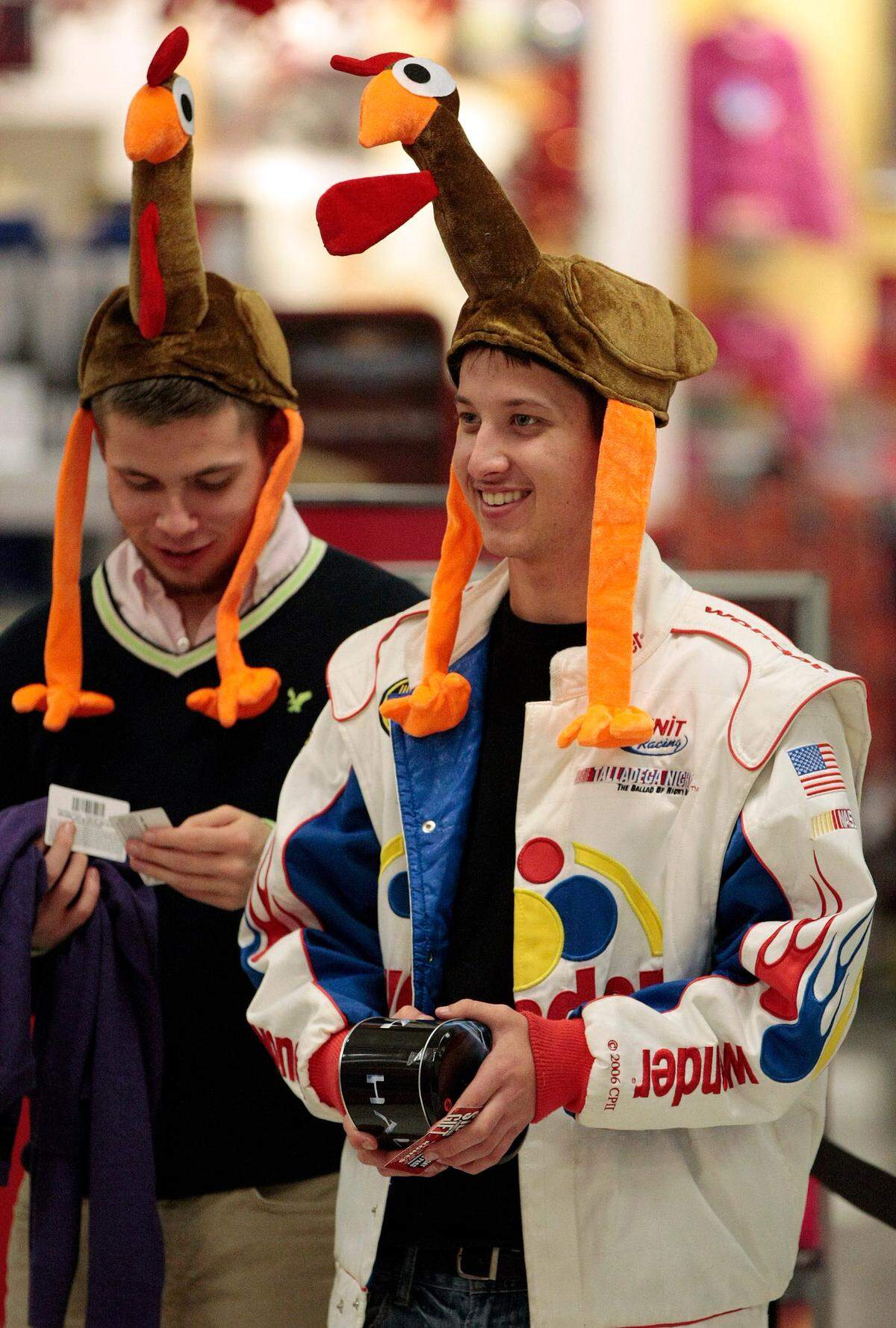 2013: Sporting decorative head gear, early morning Black Friday shoppers Mason Fannan and Dakota Van Voast, both of Fort Worth, wait in the checkout line at a Kohl’s store in Keller, Texas.