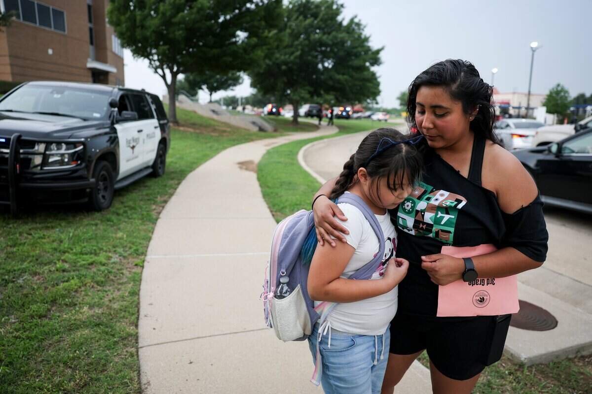 Aurora Garcia picks up her third-grader, Liza, at Basswood Elementary School, after the school was on lockdown due to a shooting-incident in a nearby neighborhood on Tuesday, April 28, 2026 in Fort Worth, Texas.