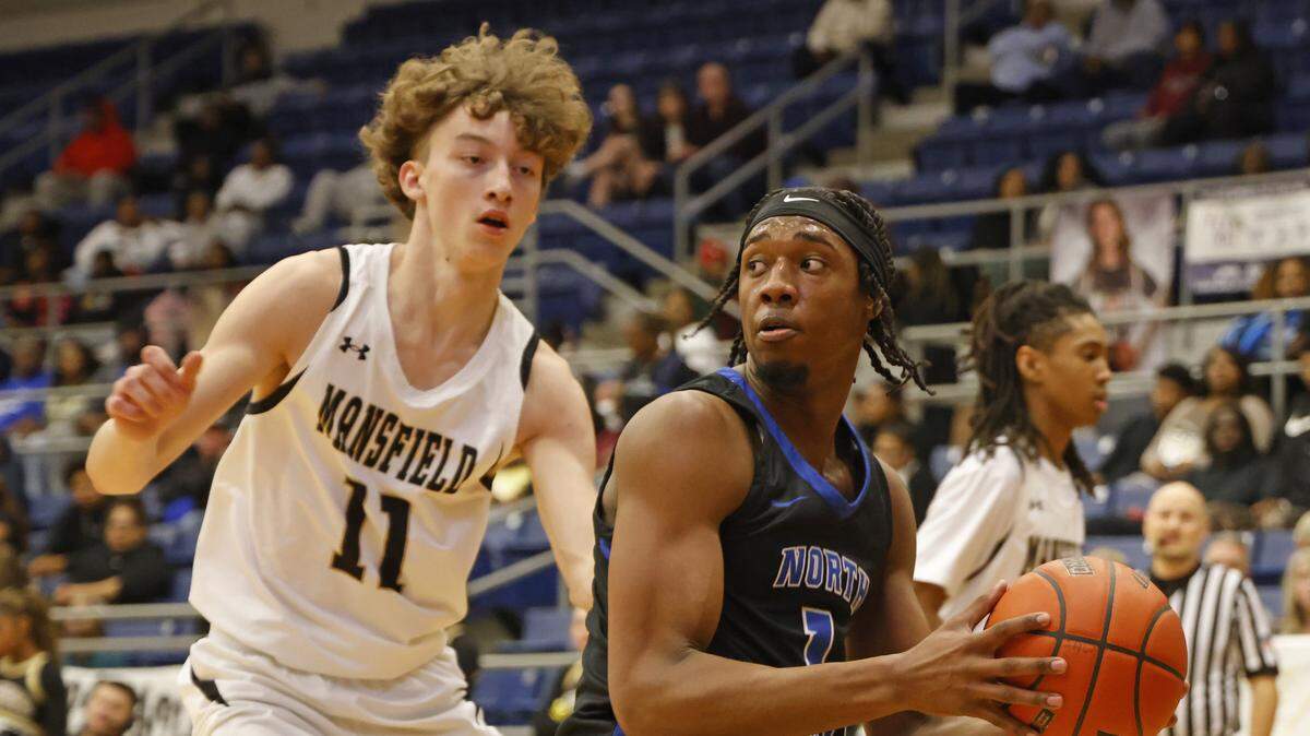 North Crowley shooting forward Alex Barther (1) looks to get the ball around Mansfield's Jack Larsen (11) during the first half of a UIL boys basketball game between North Crowley and Mansfield at Mansfield High School in Mansfield, Texas, Tuesday Jan. 20, 2026