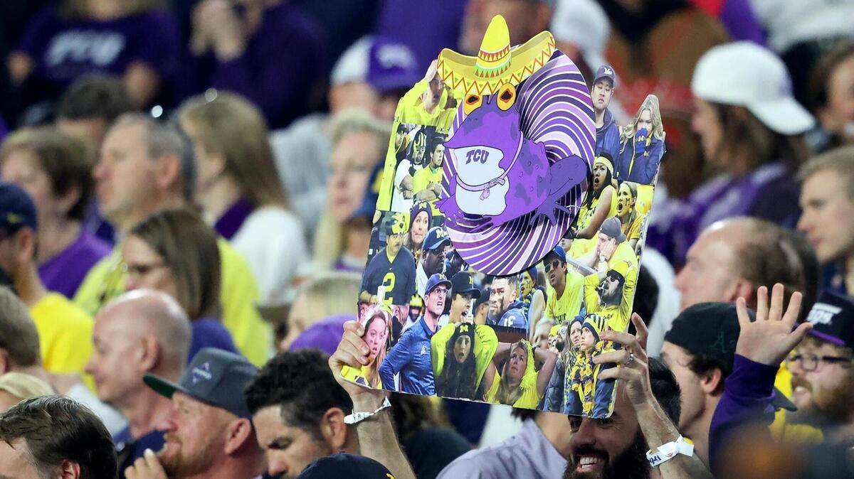 A TCU fan holds up a hypoatoad at the Vrbo Fiesta Bowl at State Farm Stadium in Glendale, Ariz., on Saturday. The hypnotoad is headed to SoFi Stadium.