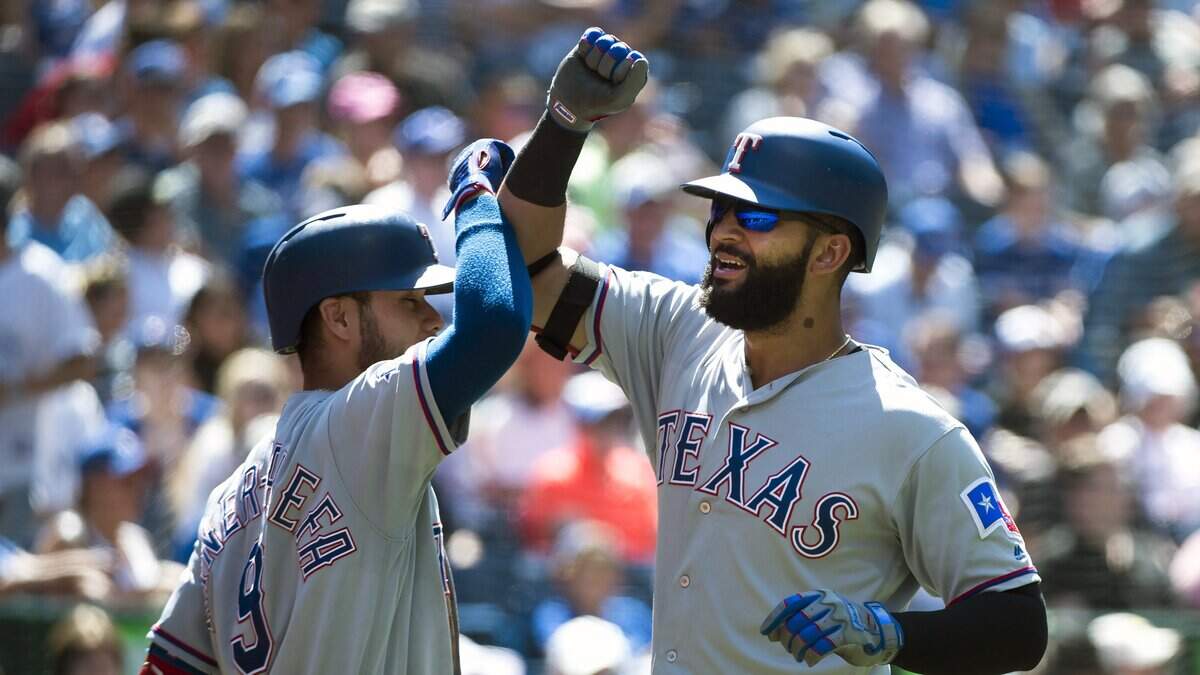 Texas Rangers’ Nomar Mazara, right, celebrates his solo home run with teammate Isiah Kiner-Falefa in the seventh inning of Wednesday’s 7-3 win against the Toronto Blue Jays.
