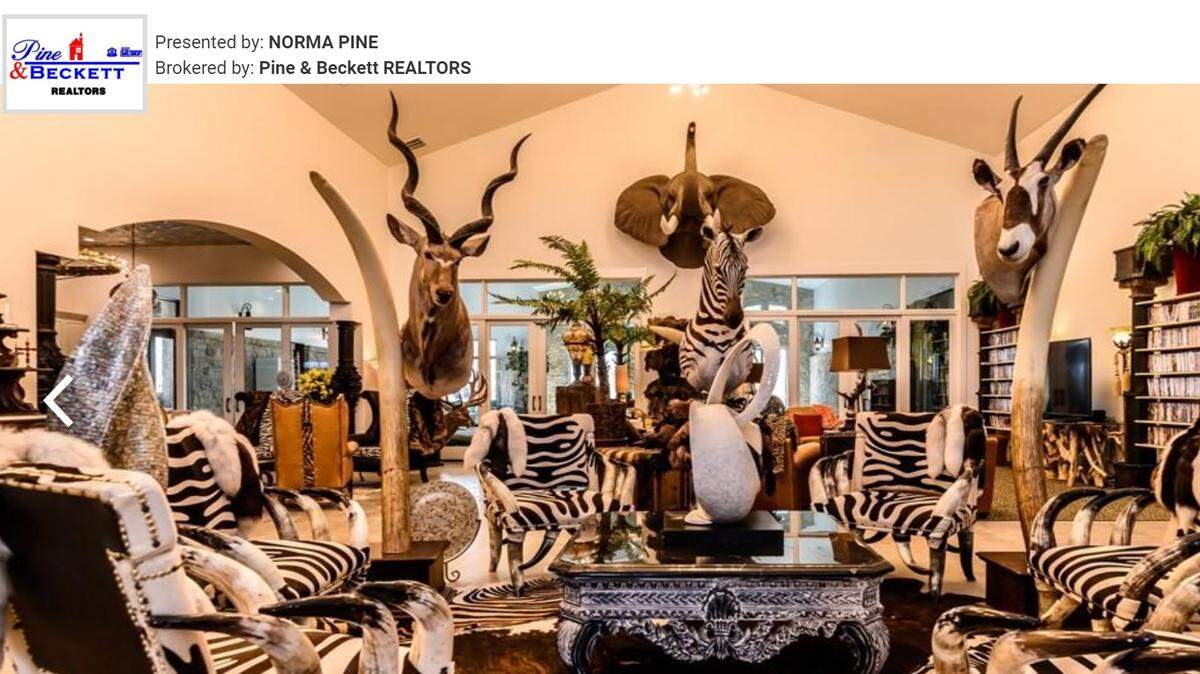 The glitzy Midland mansion with its safari decorations look like something out a wildlife museum.
