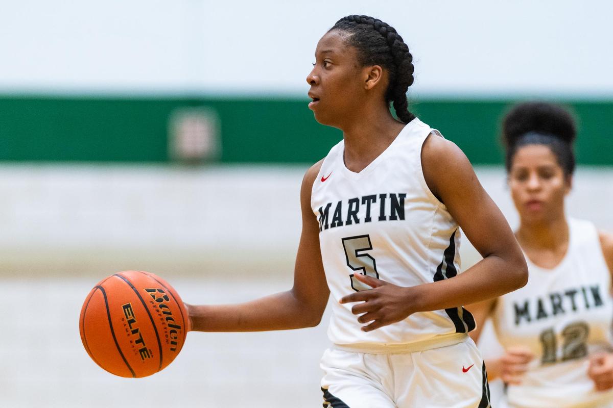 Martin Jr. Mariah Roberts (5) dribbles the ball down the court during the 1st half of the Bi-District game between Arlington Martin and Trinity at Arlington High on February 18, 2020.