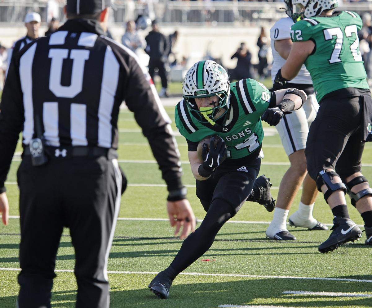 Southlake Carroll running back Brooks Biggers (24) cuts back to the inside against Denton Guyer during the first half of a UIL Class 6A Division II Quarterfinal on Saturday Dec. 06, 2025 at Crowley ISD Multi-Purpose Stadium in Fort Worth, Texas.