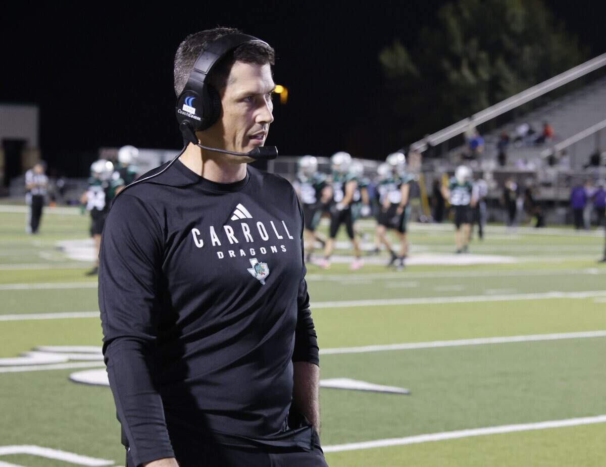Southlake head coach Riley Dodge walks the sidelines before the start of the fourth quarter of a UIL Conference 6A D2 Bi-District playoff game between Crowley and Southlake Carroll at Dragon Stadium in Southlake, Texas, Thursday, Nov. 13, 2025.