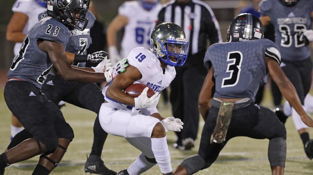 Boswell wide receiver Brandon Chatman (19) attempts to evade the defense of South Hills linebackers Ca’lub Holloway (23) and Joe Weathered (3) during the first half of a high school football game at Clark Stadium Thursday, Oct. 25, 2018. South Hills led 13-9 at the half. (Special to the Star-Telegram Bob Booth)

