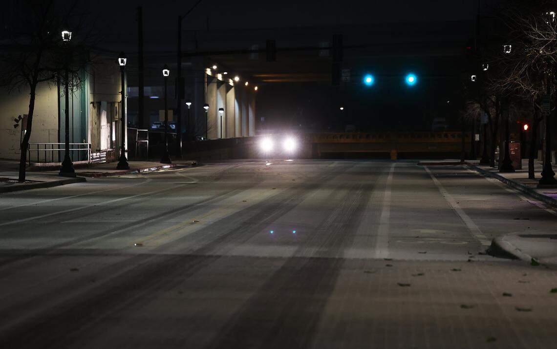 A wintery precipitation mix falls on South Main Street near downtown Fort Worth on Saturday morning, Jan. 24, 2025. A massive Arctic cold front is moving across North Texas, causing freezing temperatures.