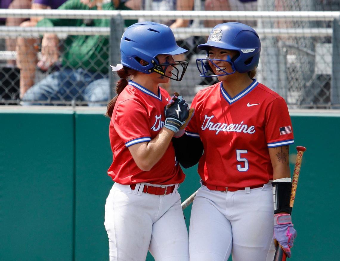 Grapevine short stop Gisele Rayngay (5) congratulates second baseman Marleigh Sign (15) after Sign scored during game 2 of the UIL softball semifinal 5A D2 playoffs at The Rabbit Hole in Forney, Texas, Saturday, May 24, 2025.