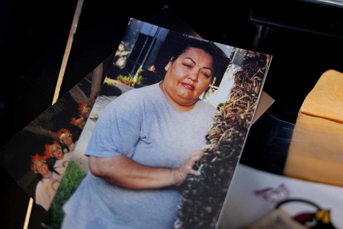 A photo of Martha Perez is found in a bin of family photos at her family's home in Prescott Valley, Arizona, on Sunday, March 9, 2025.