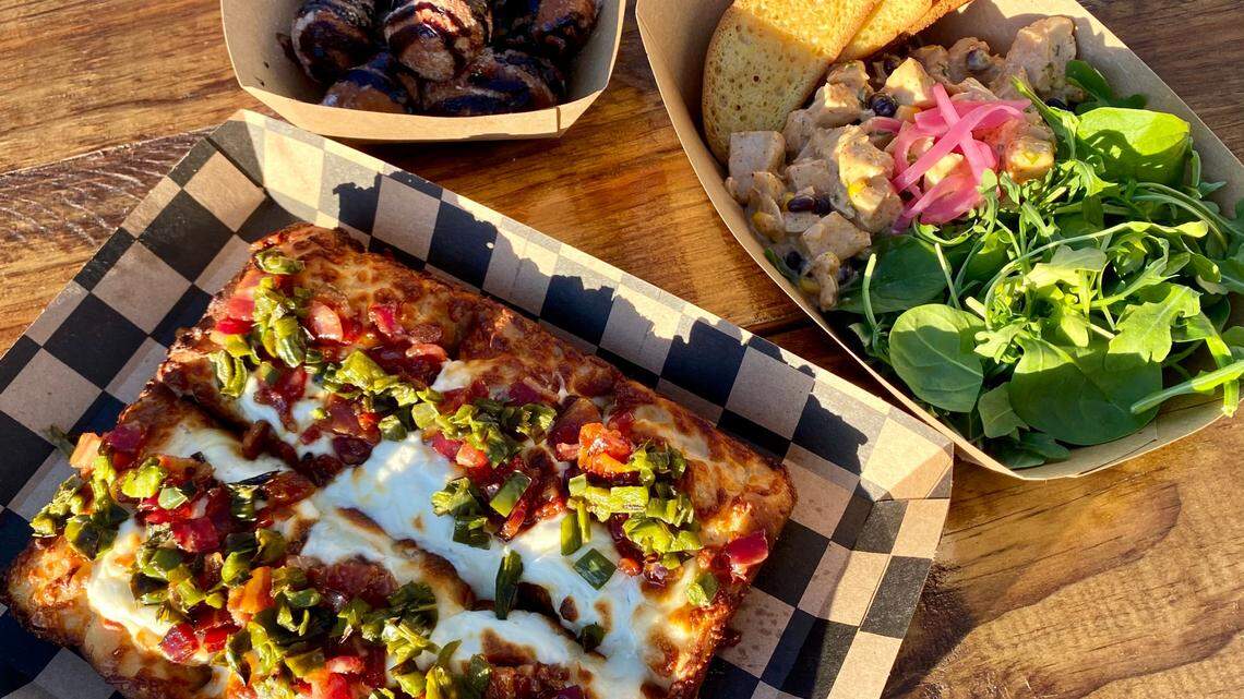 A deep-dish jalapeno-bacon-cream-cheese pizza, poached chicken salad on greens and mocha nuggets at 817 Pizza.