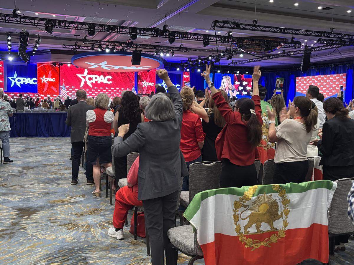 CPAC attendees sporting Iranian flag regalia cheered for two women who experienced violence under the Islamic Republic of Iran.