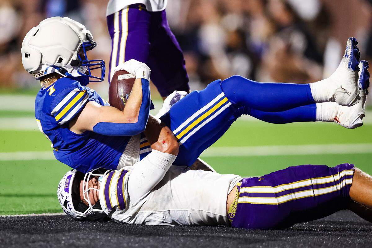 An Alvarado defensive player pulls down Sulphur Springs running back Jaxson Haire (7) for a safety in a Class 4A Division I area playoff game Friday.