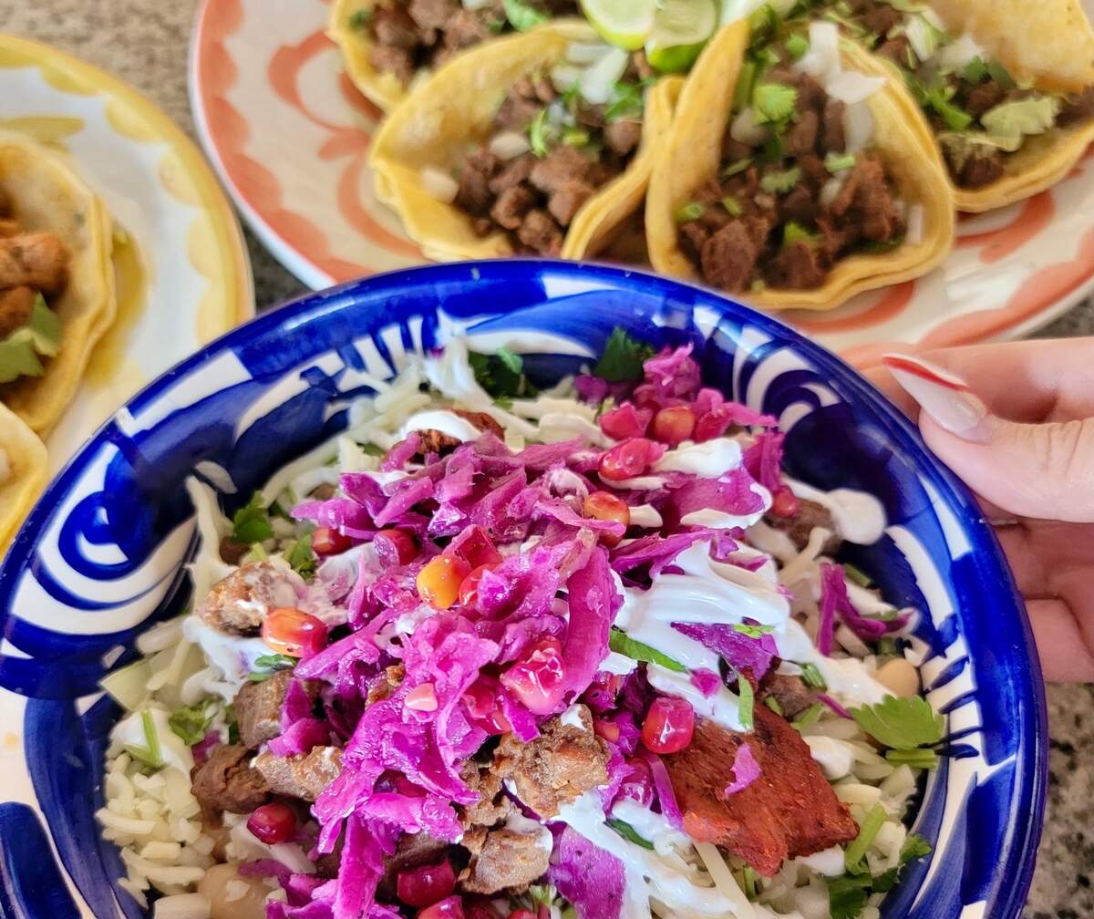 A burrito bowl and street tacos at Mariachi’s Dine-In.
