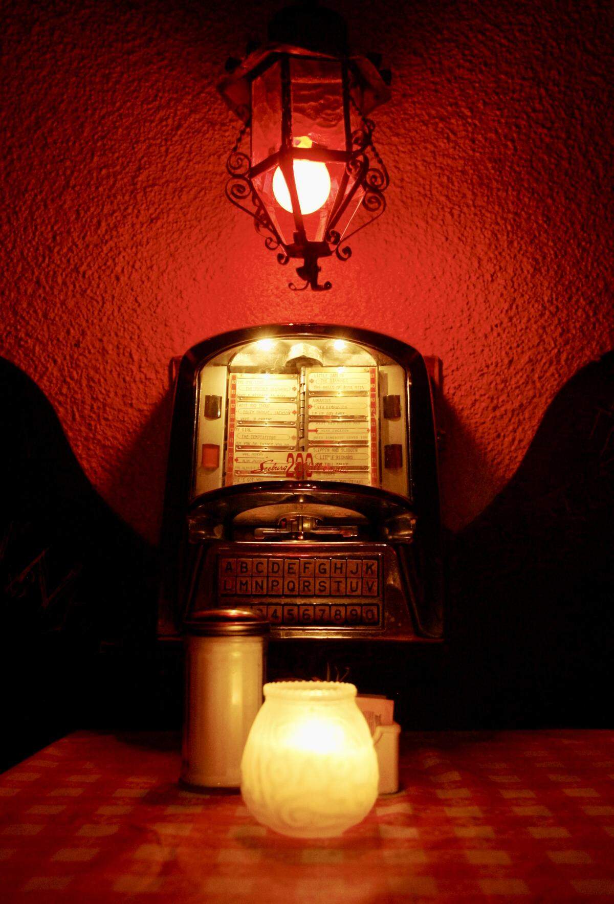 The Candlelite Inn in Arlington, Texas, is known for low lights and intimate booths with tabletop jukeboxes (non-working). Seen May 17, 2011.