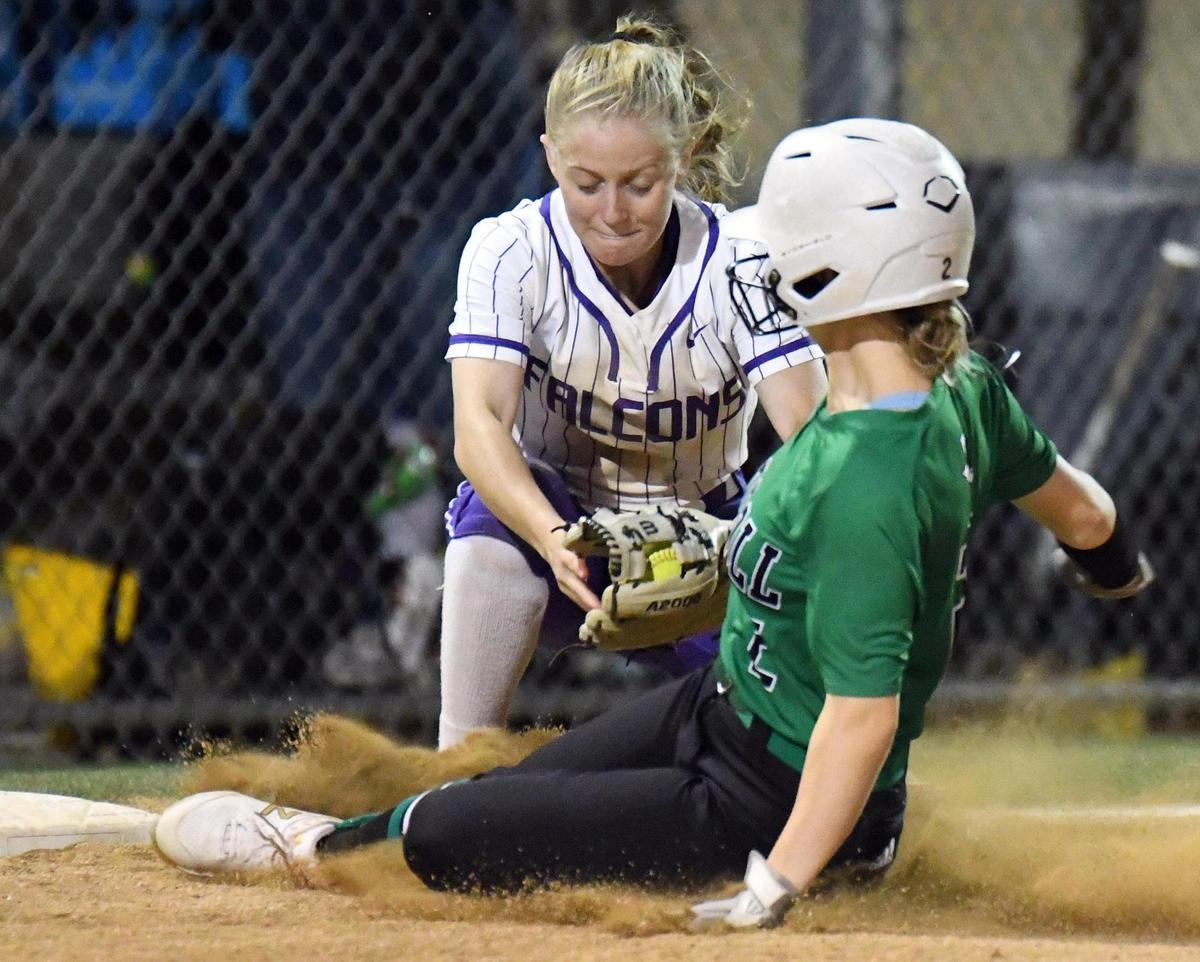 Southlake Carroll’s Claire Carrick, front beats the throw and is safeTimber Creek third base Megan Allen, tries to make the tag in the fifth inning of Tuesday’s, April 19, 2022 district 4-6A softball game at Timber Creek High School in Fort Worth, Texas. Timber Creek won 6-3. Special/Bob Haynes