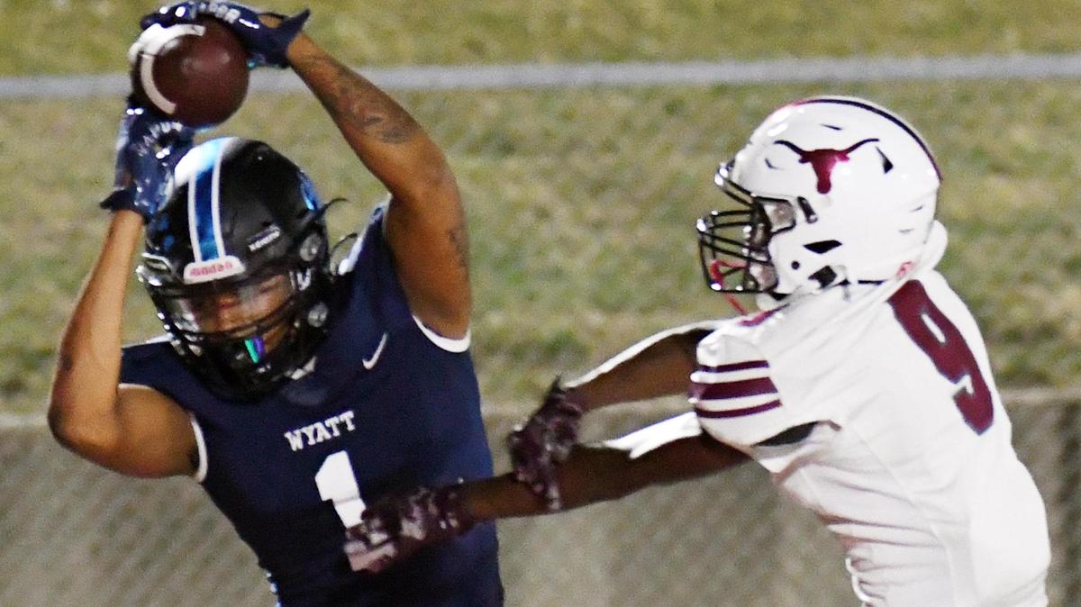 O D Wyatt’s Ahstin Watkins left makes the catch over North Side’s Darien Fantroy for the touchdown that gives the Steers a 27-14 lead at the end of the second quarter of Thursday’s October 6, 2022 District 4-5A Division 2 football game at Clark Stadium in Fort Worth, Texas. Special/Bob Haynes