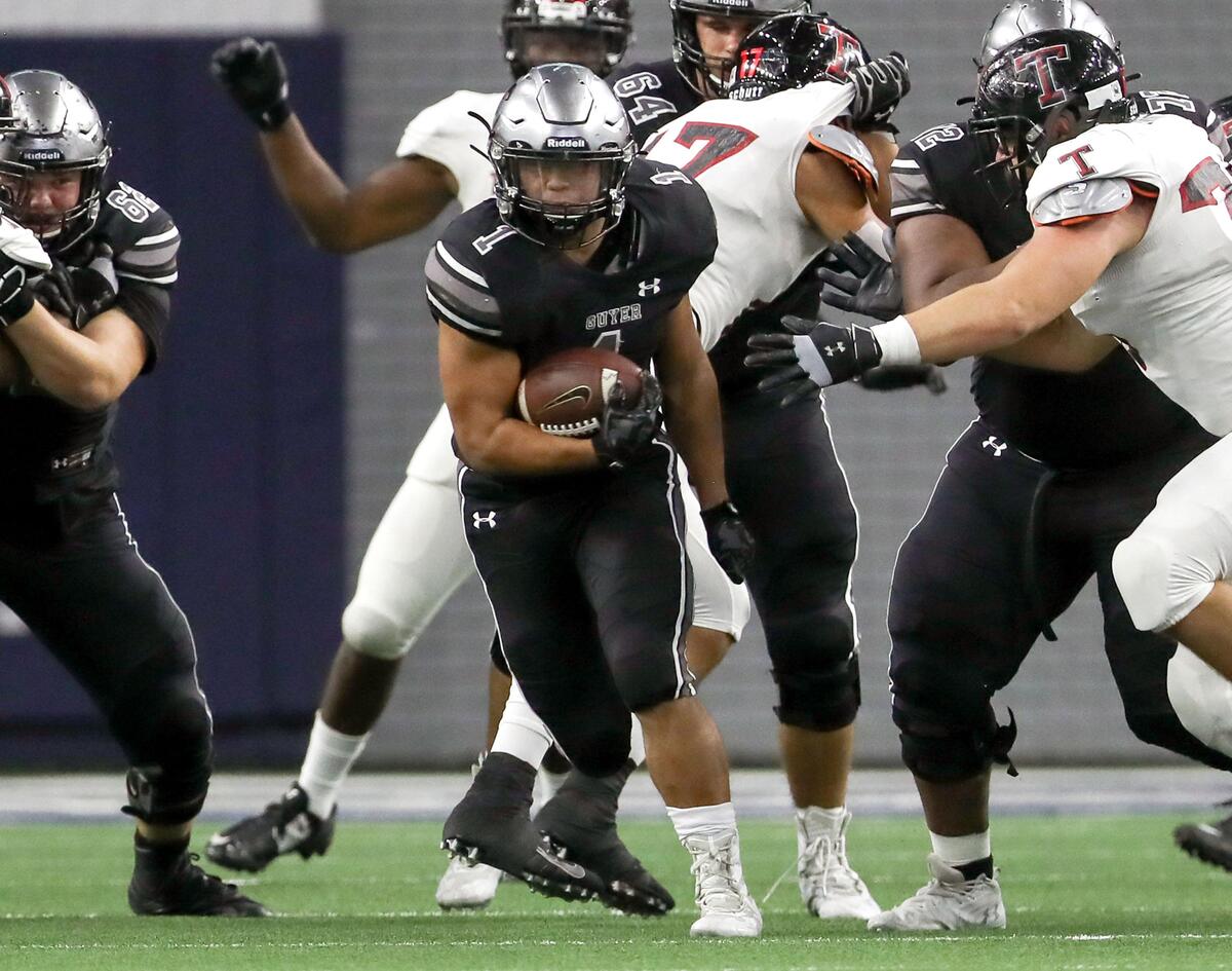 Denton Guyer running back Kaedric Cobbs (1) finds a nice hole to run against Amarillo Tascosa during the first half of the 6A Division II State quarterfinal high school football playoff game played at the Ford Center in Frisco, TX Saturday, December 7, 2019.