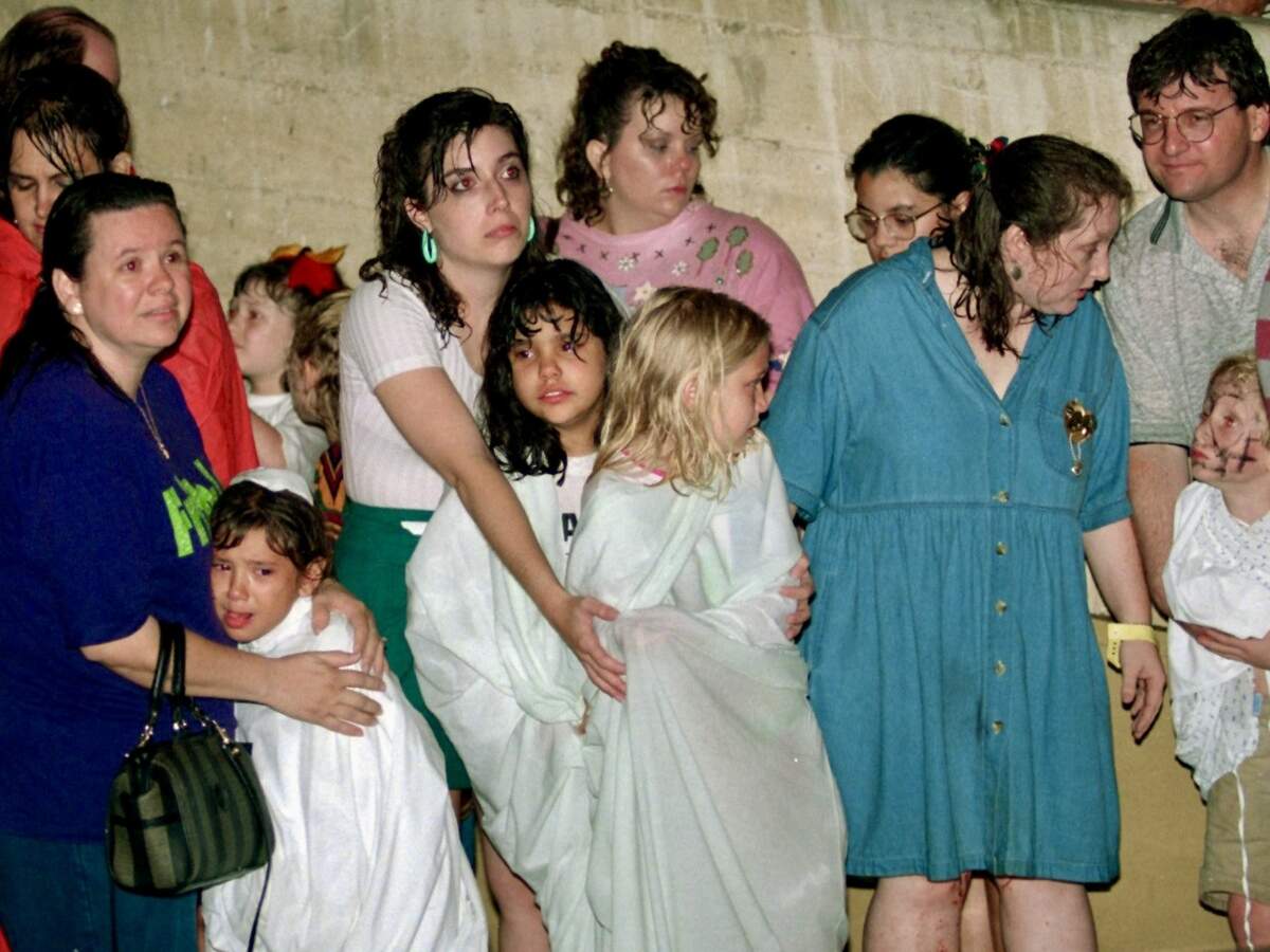 Storm victims take cover beneath Farrington Field after being pelted by the hailstorm while attending Mayfest. A triage center was set up at the football stadium to treat injuries and provide shelter from the storm May 5, 1995.