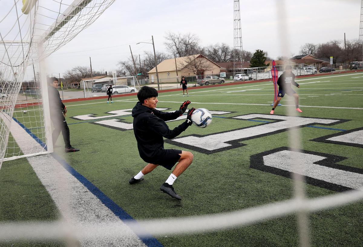 Diamond Hill-Jarvis goalkeeper Reyes Medina defends the goal while teammates run drills during practice on Thursday, Feb. 13, 2025, in Fort Worth.