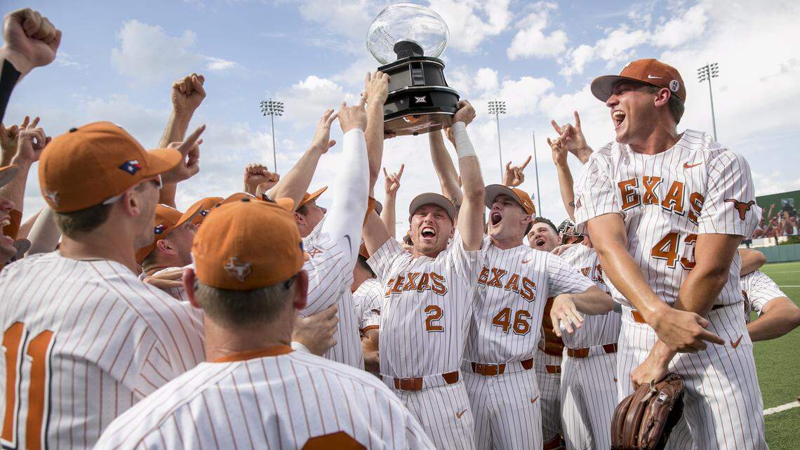 Texas' Kody Clemens holds (No. 2) and Brandon Ivey (46) hoist the Big 12 championship trophy after the Longhorns swept TCU with a 7-3 win Saturday at Disch-Falk Field in Austin. The Horned Frogs finished in fifth place at 10-13 in the Big 12, their first losing conference record since 2000.