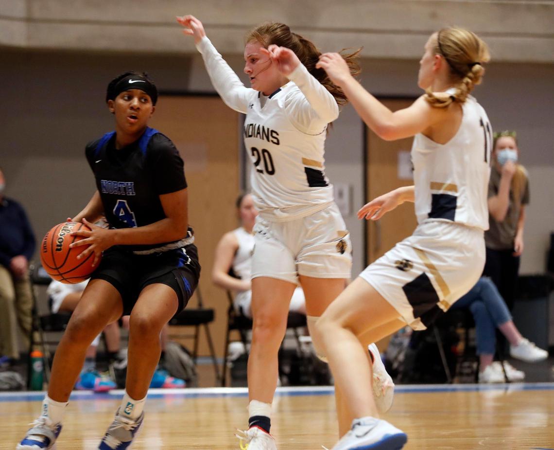 North Crowley guard Brandy Jones (4) looks to get out of the corner defended by Keller guards Gabby Czajkowski (20) and Renee Chmiel (11) during the first half of a Division 6A Region 1 quarterfinal basketball game at Arlington ISD Complex in Arlington, Texas, Thursday, Feb. 25, 2021. Keller led 31-26 at the intermission. (Special to the Star-Telegram Bob Booth)