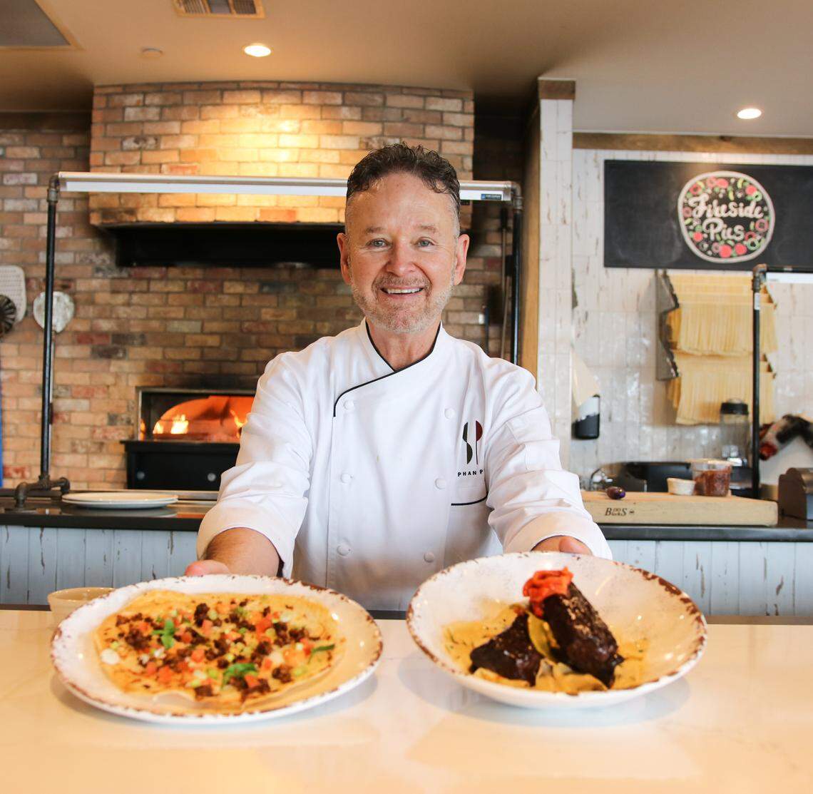 Chef Stephan Pyles with his new specials for Fireside Pies.