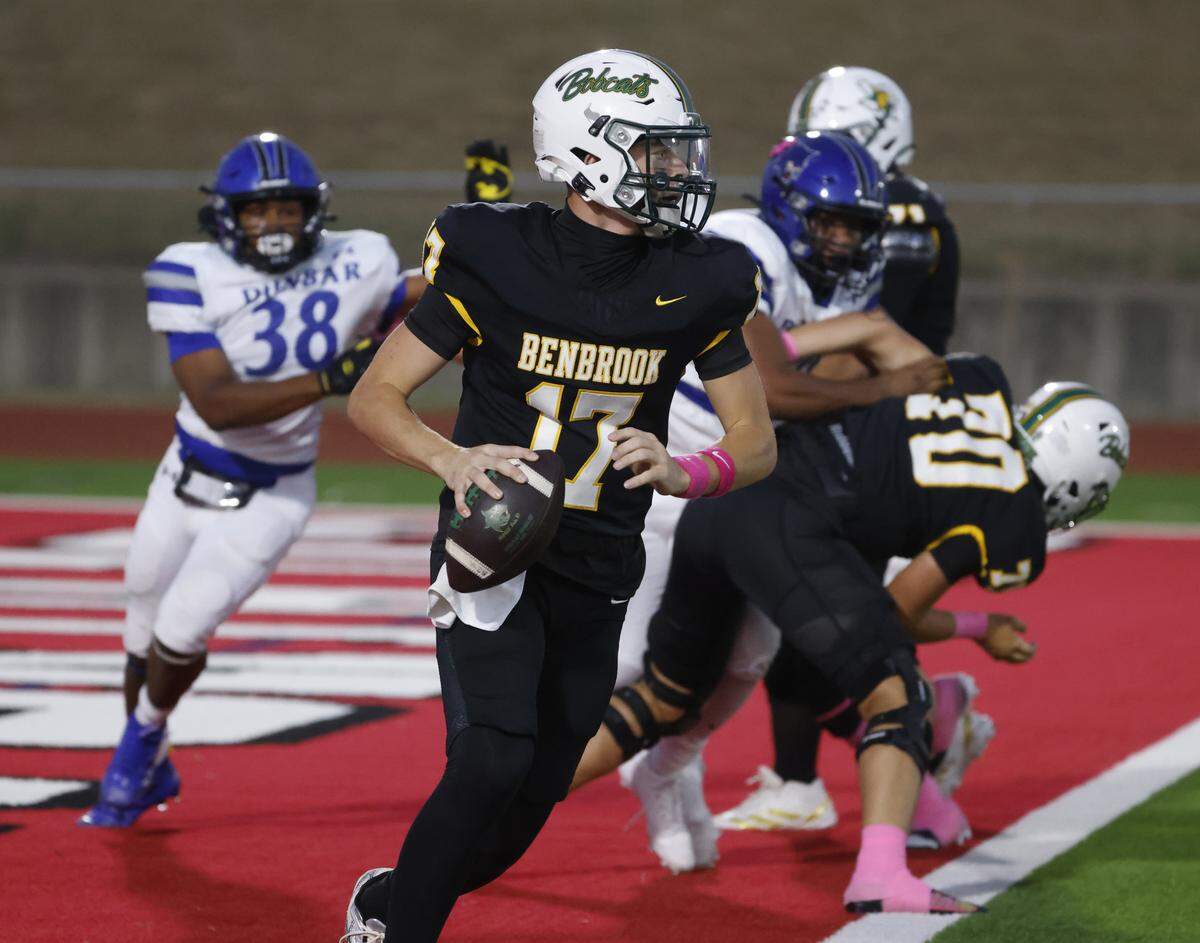 Benbrook quarterback Brennan Barton (17) scrambles out of the end zone during the first half of a UIL football game between Benbrook and Dunbar at Herman E. Clark Stadium in Fort Worth, Texas, Friday, October 10, 2025.