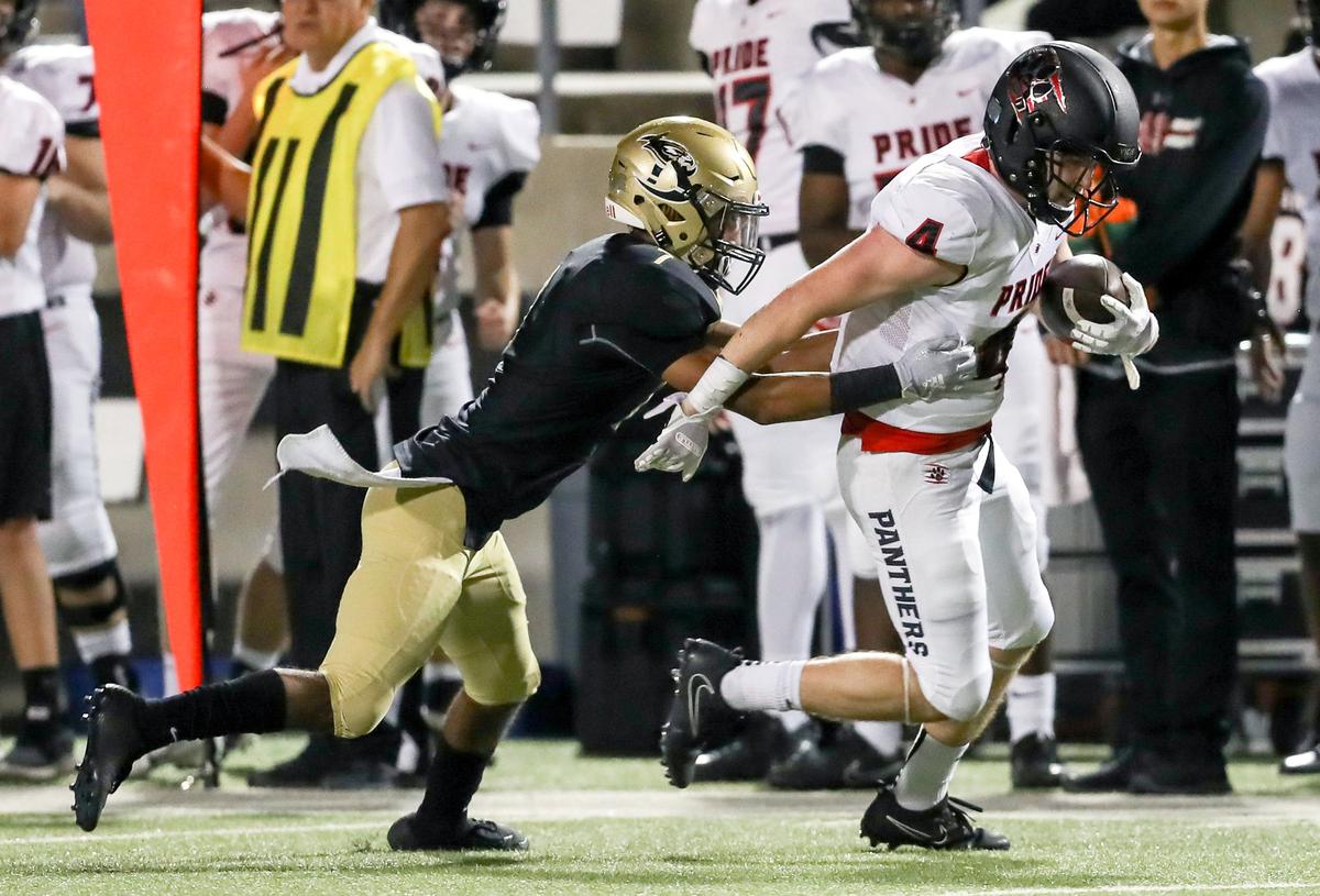 Colleyville Heritage wide receiver Jacob Fex (4) tries to break free from Birdville defensive back Hosea Armstrong (4) during the first half, Friday night, November 2, 2018 played at Birdville ISD Fine Arts Athletics Complex in N. Richand Hills, TX
