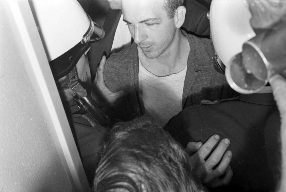 Nov. 22, 1963: Lee Harvey Oswald in police custody in Dallas, following the assassination of President John F. Kennedy.