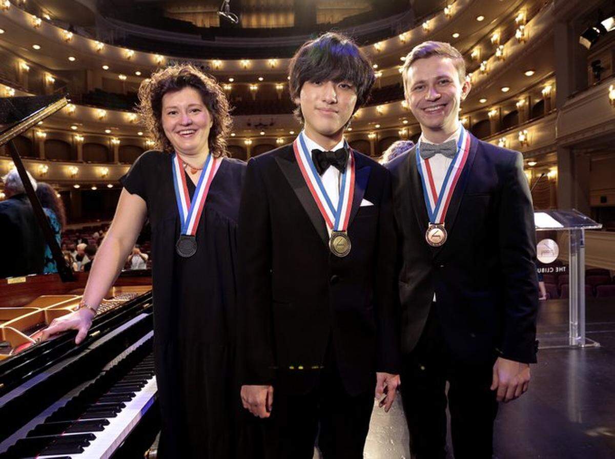 Yunchan Lim (center), 18, from South Korea, won the gold medal at the 2022 Van Cliburn International Piano Competition in Fort Worth. The silver medal was awarded to Russian pianist Anna Geniushene (lef), 31, and the bronze medal was awarded to Ukrainian pianist Dmytro Choni (right), 28.