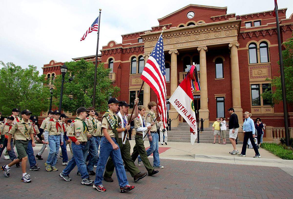 April 8, 2006: The Boy Scouts of Southlake Troop 928 Longhorn Council led the opening parade in Southlake Town Square’s grand opening, which included several new stores, a hotel and movie theater.
