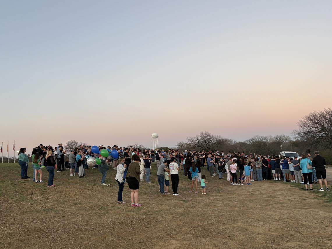 Friends and family gather at Arlington’s Veterans Park on Friday Feb. 27, 2026, to honor 14-year-old Riley Jordan, who was killed in a shooting accident the previous week.