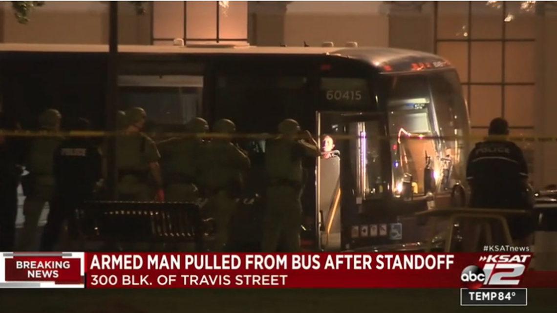 A man barricaded himself inside a Greyhound bus after stabbing a passenger, San Antonio police say.